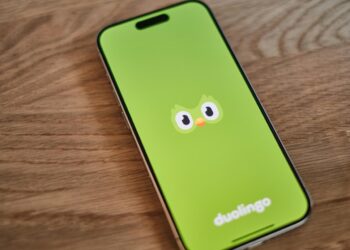 A green phone with a face drawn on it